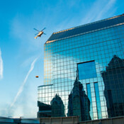 Thackray Crane Helicopter Carrying Load To Roof Top