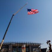 Thackray Crane - Lincoln Financial Field Crane Holding American Flag