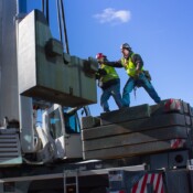 thackray-crane-cape-may-lewes-ferry-men-installing-crane-counterweights
